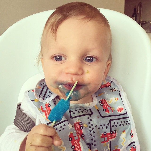 14 months today...his first tooth finally appeared and he had his first popsicle.