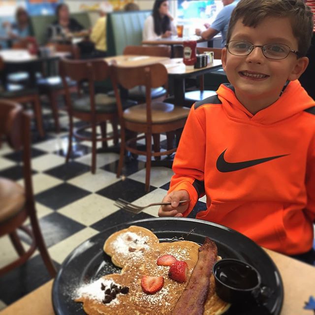 Celebrating a wonderful first week at his new school with pancakes.