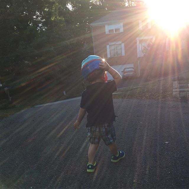 Loving his new helmet and a sunny day.
