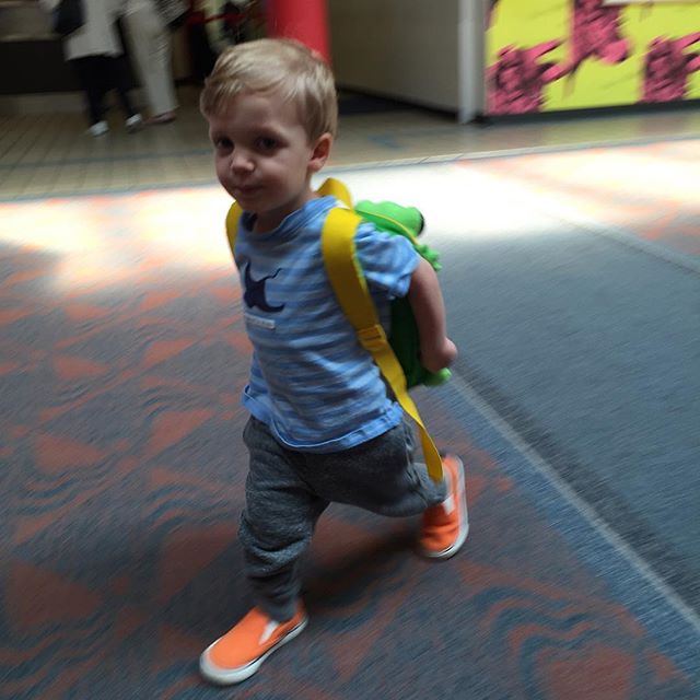 R loved walking around the airport with his new backpack.