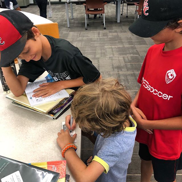 signing his first library card